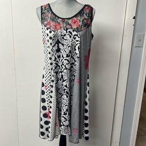 Lightweight, colorful, variety of fabric sleeveless dress.